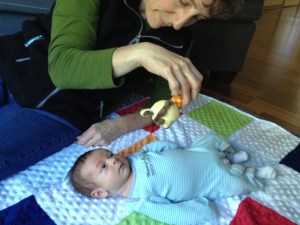 Playing with his rattle!