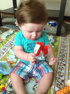 Great parenting skills: Letting your kid play with your candy wrapper!