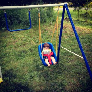 Reading the instructions for his new swing!