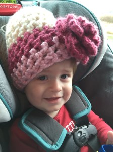 Wearing Mommy's hat on the way back from getting our tree