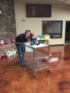 Helping Dad set up for Easter Eggstravaganza