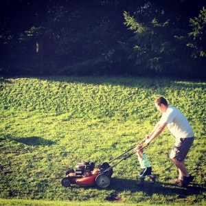 Helping Dad mow the yard