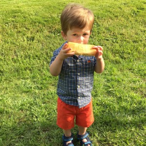 A boy and his hot dog bun