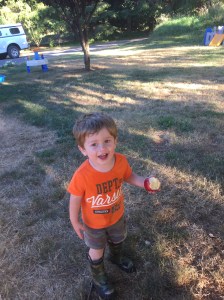 Eating an apple from Daddy's garden