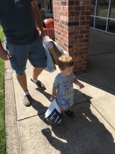 It was hard to get a good picture, but here is Owen walking around with his very own shopping bag. He really got into the shopping experience!