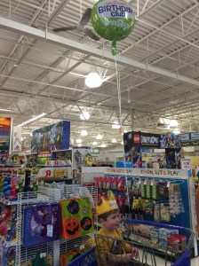 Enjoying his birthday treats from Toys'R'Us